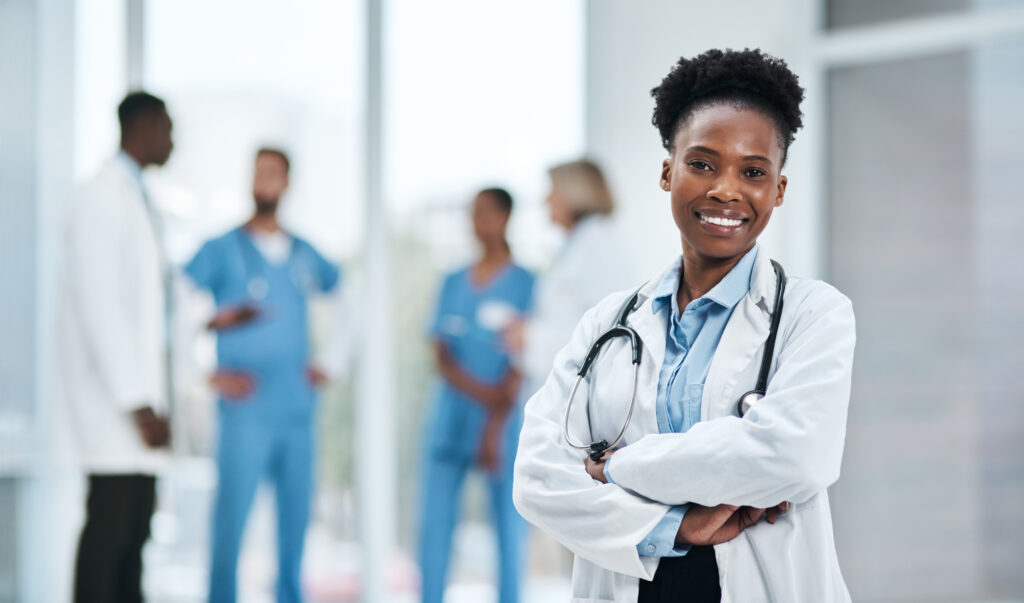 Portrait of a young doctor standing in a hospital.